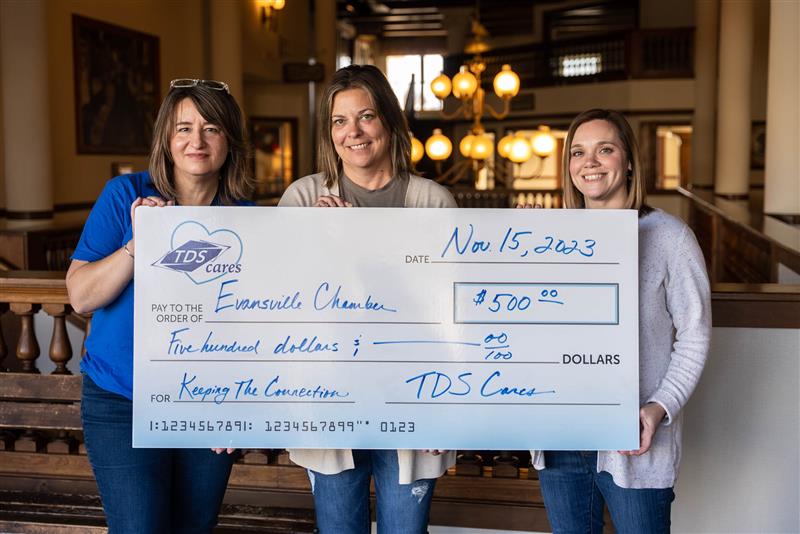TDS Cares Funding Request 3 women holding large check